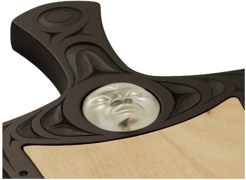 Cheese board with Indigenous motif design and pewter moon mask