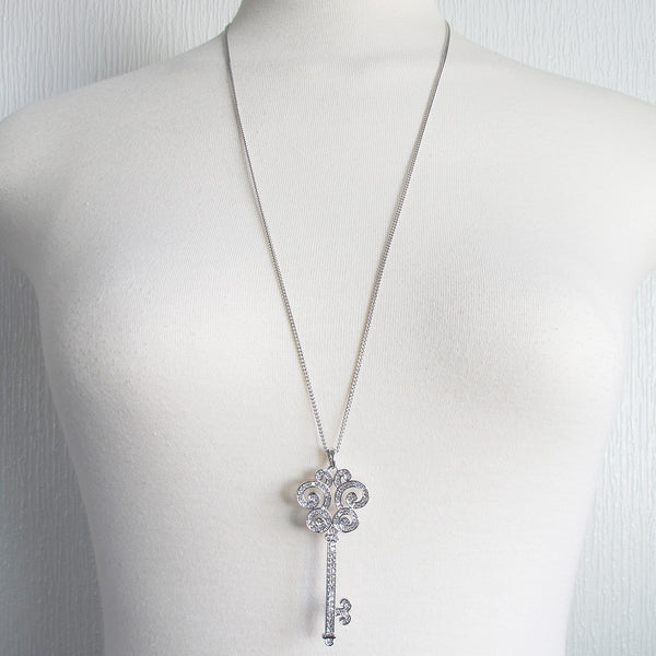 Glimmering key pendant long necklace