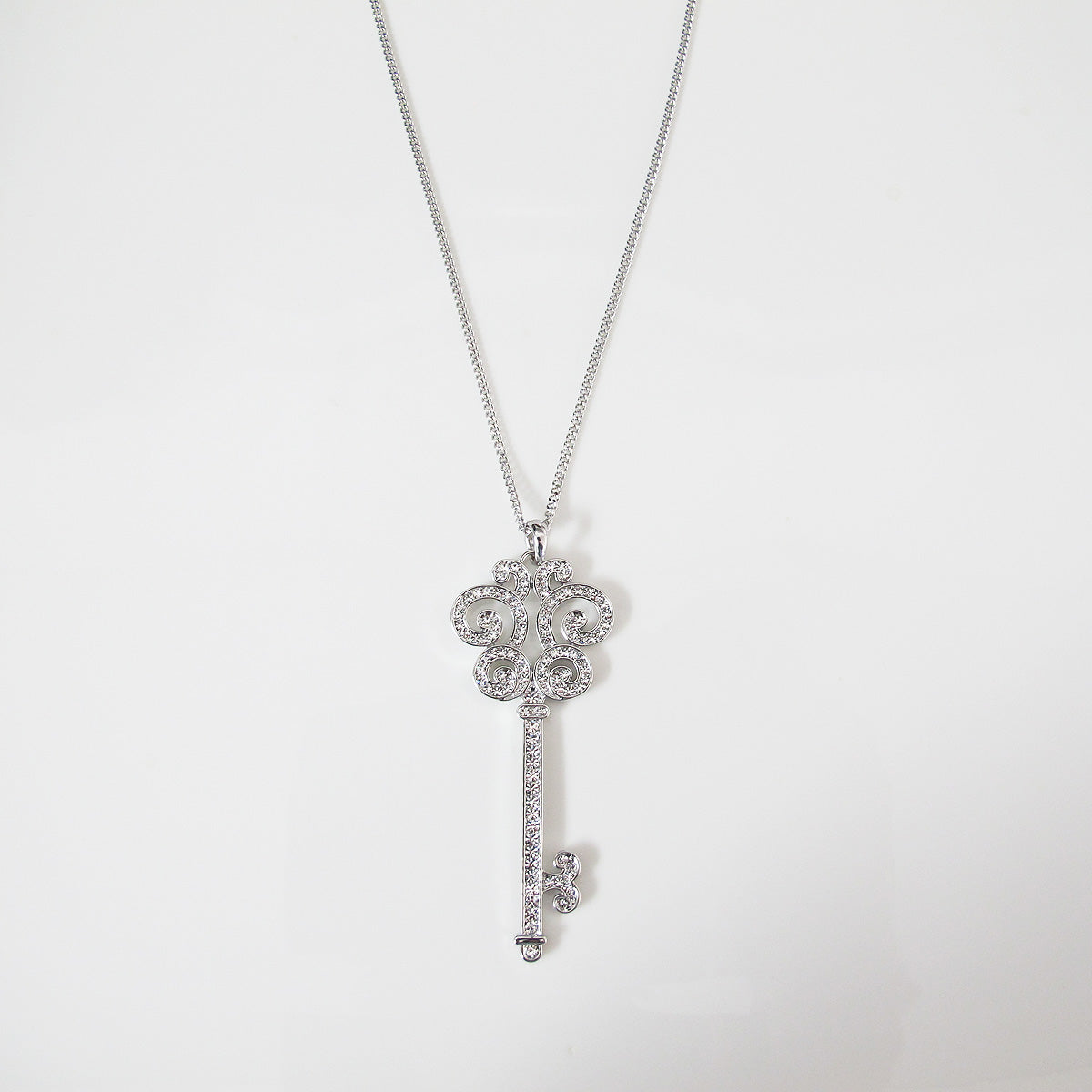 Glimmering key pendant long necklace